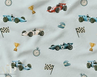 Tela vintage de coches de carreras de Fórmula 1 sobre fondo azul claro. Certificada por Oeko-Tex para costura y decoración para bebés, niños y niños. 11 telas disponibles.