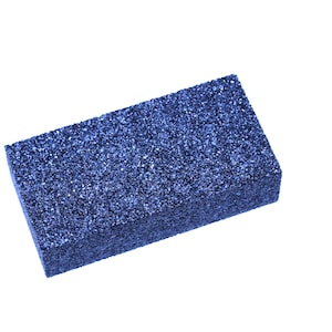 May include: A blue rectangular sanding block with a rough, textured surface.