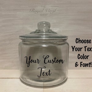 May include: A clear glass jar with a lid, featuring a black vinyl decal that says "Your Custom Text". The text "Choose Your Text, Color & Font!" is also visible in the image.