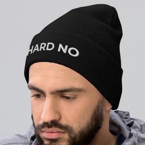 May include: A black beanie with the text "HARD NO" embroidered in white on the front.