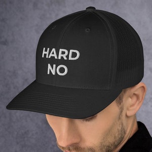 May include: A black trucker hat with a white embroidered design that says "HARD NO".