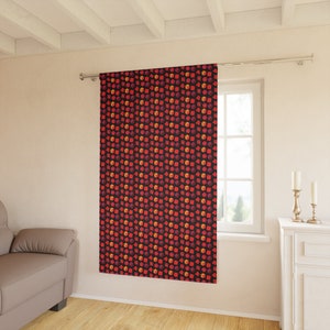 May include: A red curtain with a repeating pattern of colorful dice. The dice are in shades of red, orange, and purple.