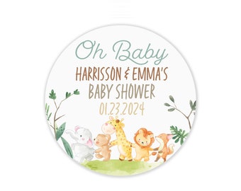 May include: A round, white baby shower favor tag with green foliage, a brown, white, and yellow giraffe, a brown bear, a white rabbit, a brown lion, and a red fox. The text reads "Oh Baby Harrison & Emma's Baby Shower 01.23.2024".