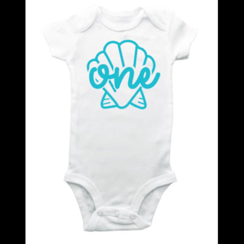 May include: White baby onesie with a blue seashell and the word "one" inside the shell.