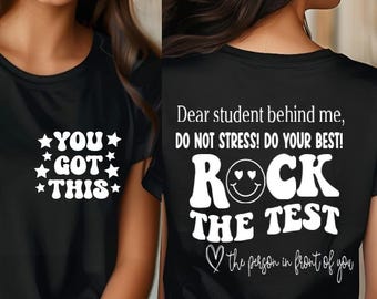 May include: Black t-shirt with white text on the front that says "You Got This" and white text on the back that says "Dear student behind me, Do Not Stress! Do Your Best! Rock The Test ♡ the person in front of you"