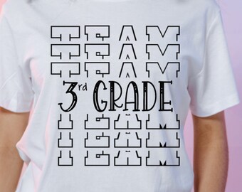 May include: White t-shirt with black text that reads "TEAM 3rd GRADE TEAM" in a stylized font.