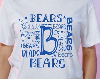 May include: White t-shirt with a blue graphic design that says "BEARS" multiple times in different sizes and styles. The graphic design is arranged in a circle around a large blue letter "B".