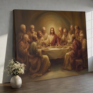 May include: A rectangular canvas print depicting the Last Supper, featuring Jesus at the center of a long table surrounded by twelve figures in robes. The scene uses a warm, sepia-toned color palette with soft lighting emanating from behind Jesus.