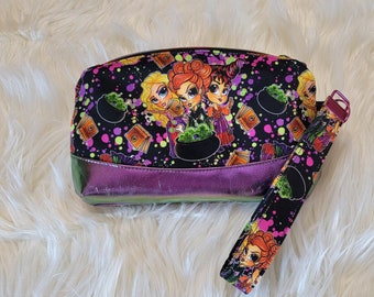Custom fabric Hocus Pocus inspired wristlet with Sanderson Sisters custom zipper pull, faux chameleon leather vinyl bottom, Ms Fits fabric
