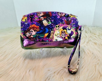 Custom fabric Hocus Pocus inspired wristlet with Sanderson Sisters custom zipper pull, faux chameleon leather vinyl bottom