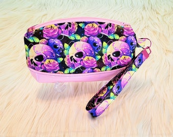 Handmade wristlet clutch with removal strap, horror themed custom fabric, rockabilly rainbow skullprint