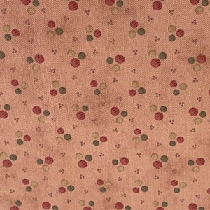 May include: A seamless fabric pattern with a repeating design of small red, green, and brown circles on a light brown background.