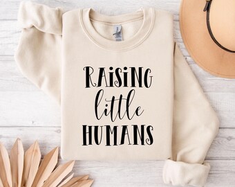 Archivos SVG de "Criando pequeños humanos", cortes de camisetas para mamá