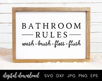 May include: A white sign with a black wooden frame and the text "BATHROOM RULES wash - brush - floss - flush" in black lettering.