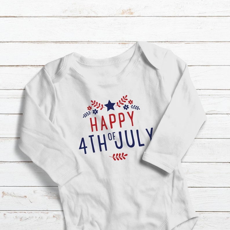 May include: White long-sleeve baby onesie with red and blue text that reads "Happy 4th of July" with a star and floral accents.