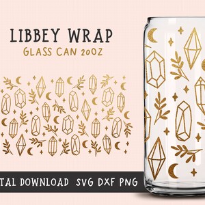 May include: Gold glitter design featuring geometric shapes, crescent moons, and small sprigs of leaves on a clear glass can. The can is labelled "Libbey Wrap Glass Can 20oz".