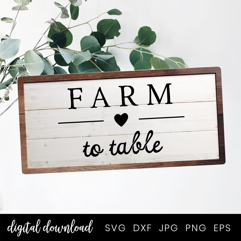 Op de afbeelding: Een wit houten bord met een bruin frame, met de tekst "FARM to table" met een zwart hart tussen de woorden.