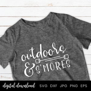May include: A gray t-shirt with the text "outdoors & s'mores" in white. The text is in a handwritten font and includes a graphic of two marshmallows on sticks.