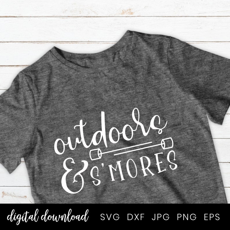 May include: A gray t-shirt with the text "outdoors & s'mores" in white. The text is in a handwritten font and includes a graphic of two marshmallows on sticks.