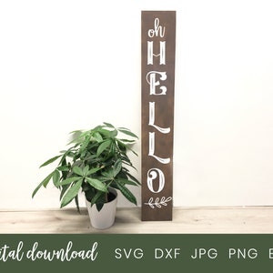 Puede incluir: Un letrero de madera marrón con las palabras "oh hello" en letras blancas. El letrero está decorado con una pequeña rama de hojas en la parte inferior.