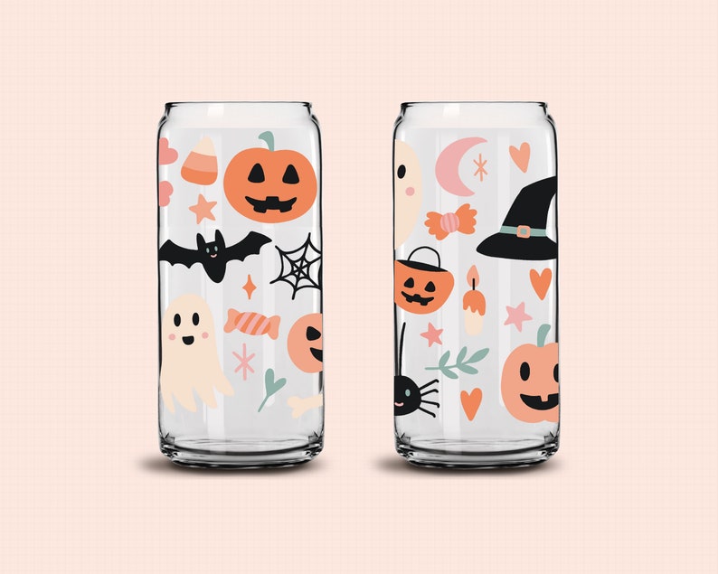 May include: Two clear glass can-shaped cups with Halloween-themed designs. The designs include pumpkins, bats, ghosts, candy corn, stars, and spiderwebs. The cups are perfect for serving drinks at a Halloween party.