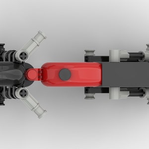 May include: Top view of a black and red toy motorcycle with a black seat and silver exhaust pipes. The motorcycle has a black tire on the front and a black tire on the back. The motorcycle has a black and white sticker on the side that says "MT 5541".