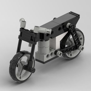 May include: A black and gray LEGO motorcycle model with a detailed design. The motorcycle has a black seat, black wheels with gray tires, and a black frame.