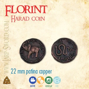 May include: A 22 mm copper coin with a patina finish. One side features an elephant, the other side features a snake. The coin has the text "Florint Harad Coin" on it.