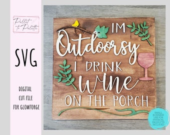 May include: A wooden sign with the text "I'm Outdoorsy I Drink Wine On The Porch". The sign is decorated with a small bird, leaves, and a glass of wine.