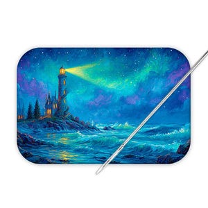 May include: A rectangular needle minder featuring a vibrant painting of a lighthouse on a rocky coast at night. The scene includes a glowing yellow light beam, a starry sky with purple and blue clouds, and crashing ocean waves. A silver needle rests diagonally across the surface.