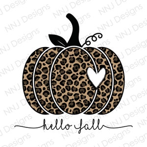 May include: A brown and black leopard print pumpkin with a white heart cutout. The pumpkin has a black stem and green leaves. The text "hello fall" is written in black cursive below the pumpkin.