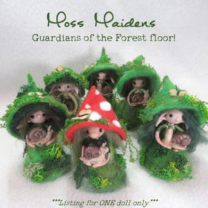 May include: A group of whimsical felt dolls, each with a unique green mossy hat and body, holding a small snail. One doll wears a red mushroom cap. The text reads "Moss Maidens, Guardians of the Forest floor!"