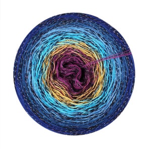 May include: A skein of yarn with a gradient of blue, yellow, and purple colors. The yarn has a metallic sheen.