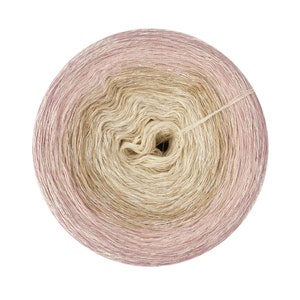 May include: A skein of yarn with a gradient of pink to beige. The yarn is wound into a ball shape and has a subtle shimmer.