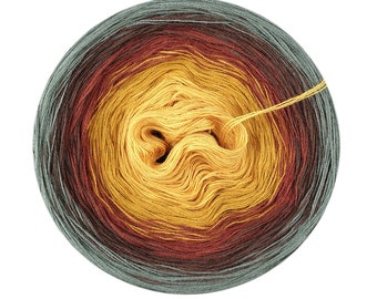 May include: A ball of yarn with a gradient of colors, starting with a dark blue, transitioning to a dark red, then a light yellow, and ending with a dark blue.