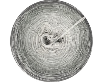 May include: A skein of silver and gray yarn with a subtle shimmer. The yarn is wound into a circular shape and is ready for knitting or crocheting.