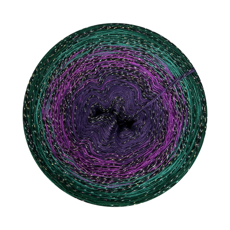 May include: A skein of yarn with a gradient of green, purple, and black colors. The yarn has a metallic sheen and is wound into a ball.