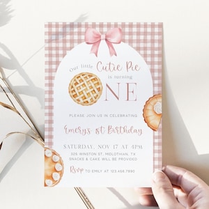 May include: A pink and white gingham patterned invitation with a watercolor illustration of a pie. The text reads "Our little Cutie Pie is turning ONE" and invites guests to Emery's 1st Birthday.