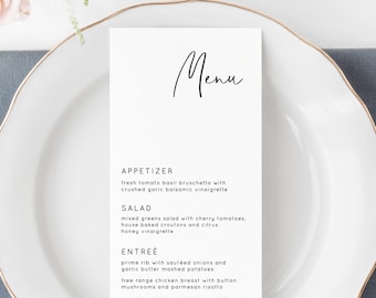 Könnte beinhalten: Eine weiße Speisekarte mit einem handschriftlichen 'Menü' Titel in Schwarz. Die Speisekarte listet Vorspeisen, Salat, Hauptgericht und Dessert Optionen auf. Die Speisekarten-Artikel beinhalten frische Tomaten-Basilikum-Bruschetta, gemischten grünen Salat, Prime Rib mit sautierten Zwiebeln und Hochzeitstorte.