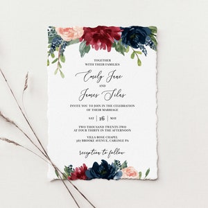 May include: Wedding invitation with a floral design in shades of burgundy, navy blue, and blush pink. The invitation announces the marriage of Emily Jene and James Silas on Saturday, May 16th, 2022 at 4:30 PM at Villa Rose Chapel, 567 Brooke Avenue, Carlisle, PA. The reception will follow.