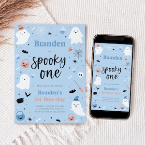 May include: A light blue Halloween-themed invitation and a smartphone displaying the same design. The invitation and phone screen feature white ghosts, bats, and the text "spooky one". The invitation is for Branden's 1st Boo-day.