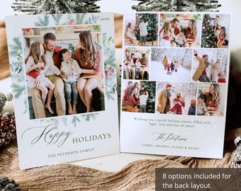 May include: Holiday greeting cards with family photos. The front card has a family photo surrounded by a green and white botanical border. The words "Happy Holidays" and "The Peterson Family" are written in green script. The back of the card has multiple family photos.