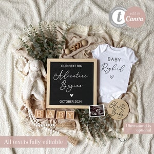 May include: A black letter board with the text "Our next big adventure begins" and "October 2024". A white onesie with the text "Baby [name]" and a heart. A wooden circle with the text "Hello Baby". A wooden block spelling "Baby". A white stuffed animal and a garland of wooden beads.