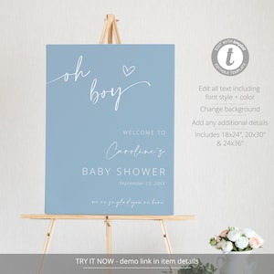 Pode incluir: Um cartaz de boas-vindas para um ch&aacute; de beb&ecirc; azul claro com texto branco que diz "oh boy" com um pequeno cora&ccedil;&atilde;o, "Bem-vindo ao ch&aacute; de beb&ecirc; de Caroline", "Setembro 23, 20XX", e "estamos t&atilde;o felizes que voc&ecirc; esteja aqui".