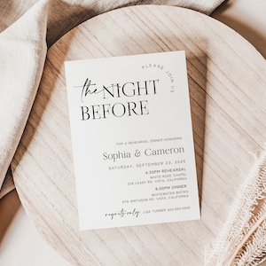 May include: A white card with black text announcing "The Night Before" for a rehearsal dinner honoring Sophia & Cameron on Saturday, September 23, 2026. The card lists the time and location for the rehearsal and dinner.