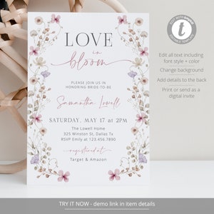 May include: A floral wedding invitation with the text "LOVE in bloom" and the bride-to-be's name, Samantha Lowell. The invitation is decorated with pink and purple flowers and greenery. The text "SATURDAY, MAY 17 at 2PM" is also included, along with the location and RSVP information. The invitation also includes the text "registered at Target & Amazon".