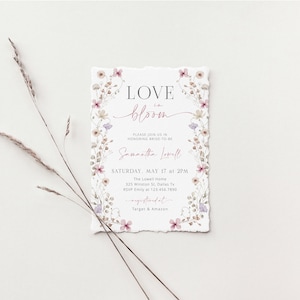 May include: A floral-themed bridal shower invitation with the text "LOVE in bloom" and "Samantha Lowell" in pink script. The invitation includes details for the event, including the date, time, location, and RSVP information. It also mentions the registry at Target and Amazon.