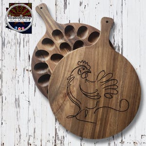 May include: A wooden serving board with a chicken design and a separate section with 18 indentations for holding eggs.