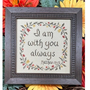 May include: A framed cross-stitch with a floral wreath design. The text reads "I am with you always, Matthew 28:20".