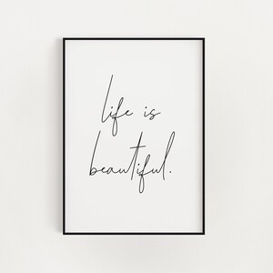 May include: Black and white printable wall art with the text "life is beautiful" written in cursive.